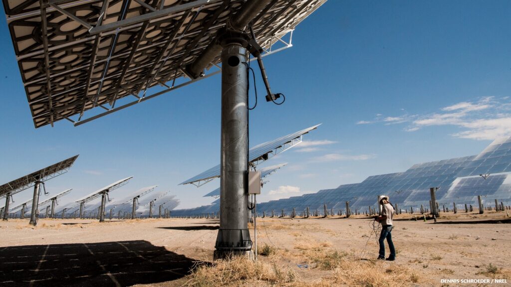 July 23, 2017 - Tonapah, NV. An employee runs diagnoses on heliostats at the Crescent Dunes Solar Thermal Facility, owned by SolarReserve. The facility, built with US sourced steel, glass and technology, provides more than 500,000 megawatt hours of electricity per year, available day or night through molten salt storage. 38 permanent jobs are required for plant operation and maintenance. This image is unusual but easy to understand, and is likely to produce a positive emotional response. Rather than a staged 'celebration' of solar energy, the grounding figure on the right attracts the eye and demonstrates experts at work.
