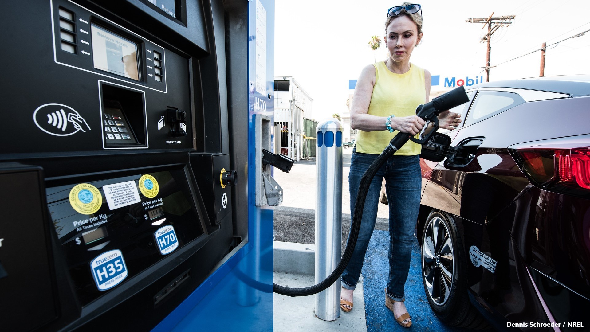 Anca Faur fuels her Honda Clarity FCEV fuel cell vehicle at a hydrogen fueling station in Hollywood, California. She is taking part in the California Fuel Cell Partnership to move fuel cell electric vehicles closer to market.