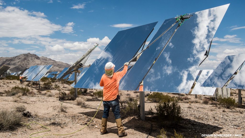 July 26, 2017 - Nipton, CA- Contracted workers clean Heliostats at the Ivanpah Solar Project, owned by NRG Energy, Bright Source Energy,Bechtel and Google. Over 300,000 software-controlled mirrors track the sun in two dimensions and reflect the sunlight to boilers that sit atop three 459 foot tall power towers. The facility employs over 65 operations and maintenance workers and over 2,600 jobs during it's 3 year construction period. This image of a worker cleaning a solar energy mirror is unusual and likely to invite the audience to discover more. Our focus groups indicated a strong desire by audiences to see new stories.