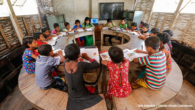 Boat School in Bangladesh, children in a class seated at a lesson