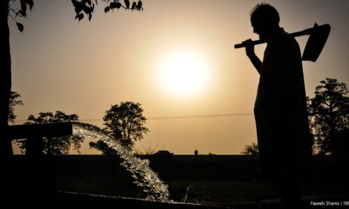 Farmer pumping groundwater for his field in rural Pakistan